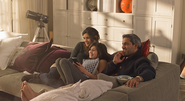 A family watching television in their home