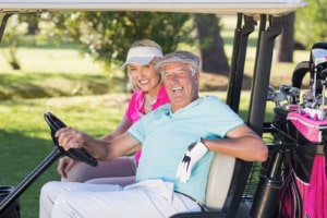 couple in golf cart