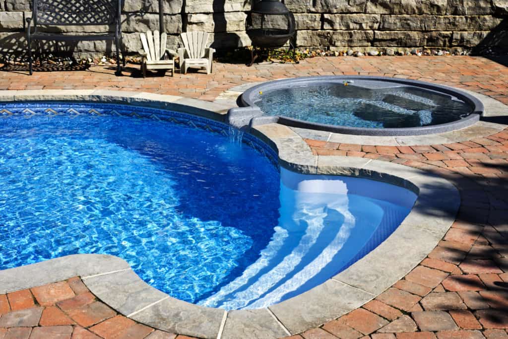 Swimming pool with hot tub